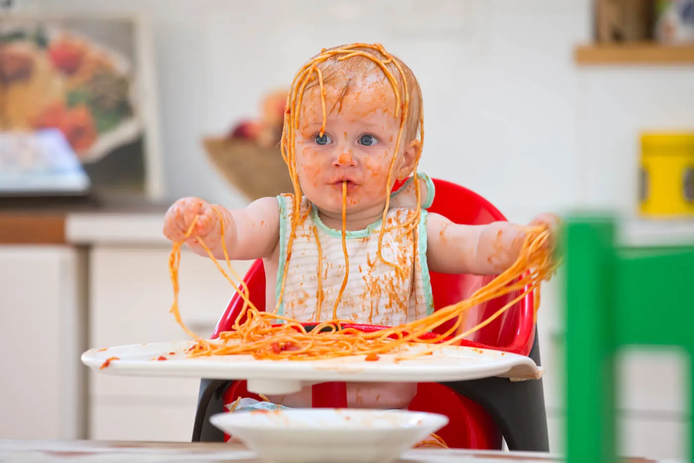 Baby spaghetti mess high chair
